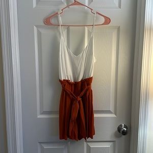 Orange and white romper by Shinestar